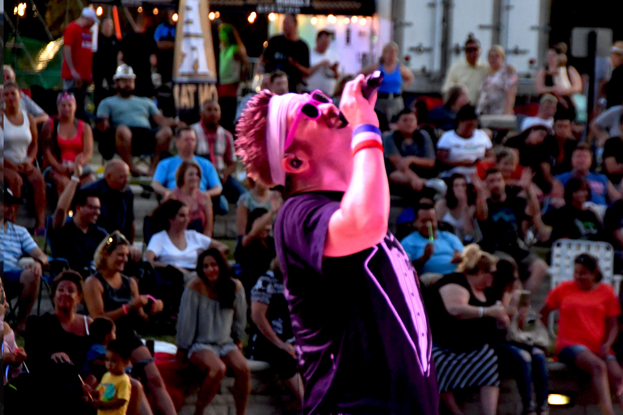 Singer on stage at Deer Crossing Park