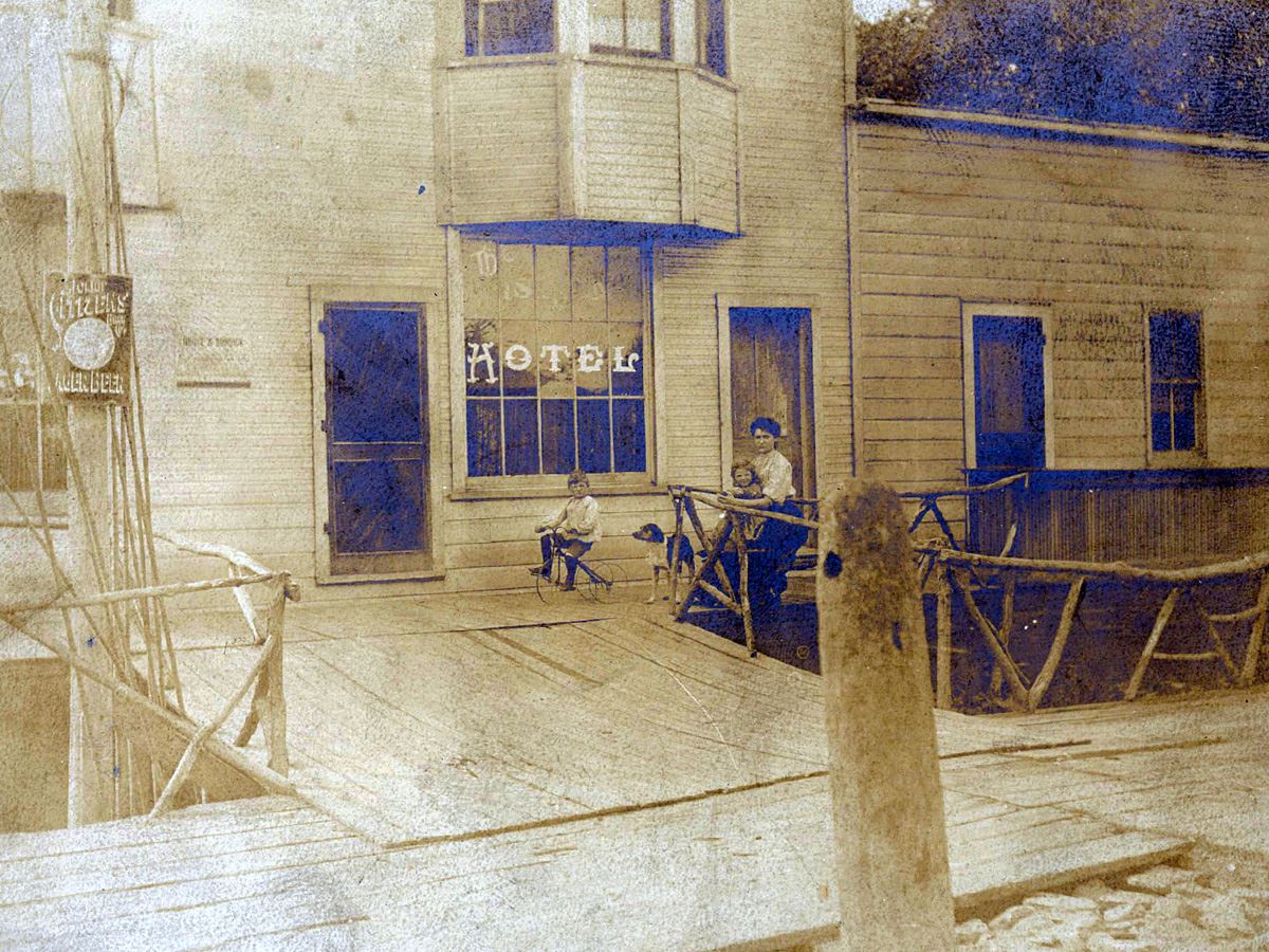 Family stands outside the Island Hotel