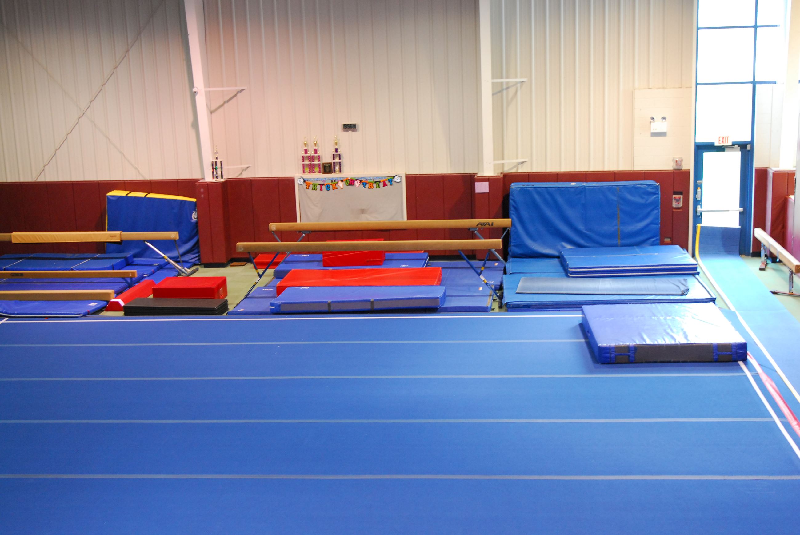 Gymnastics Room showing facility layout, mats and assorted items. 